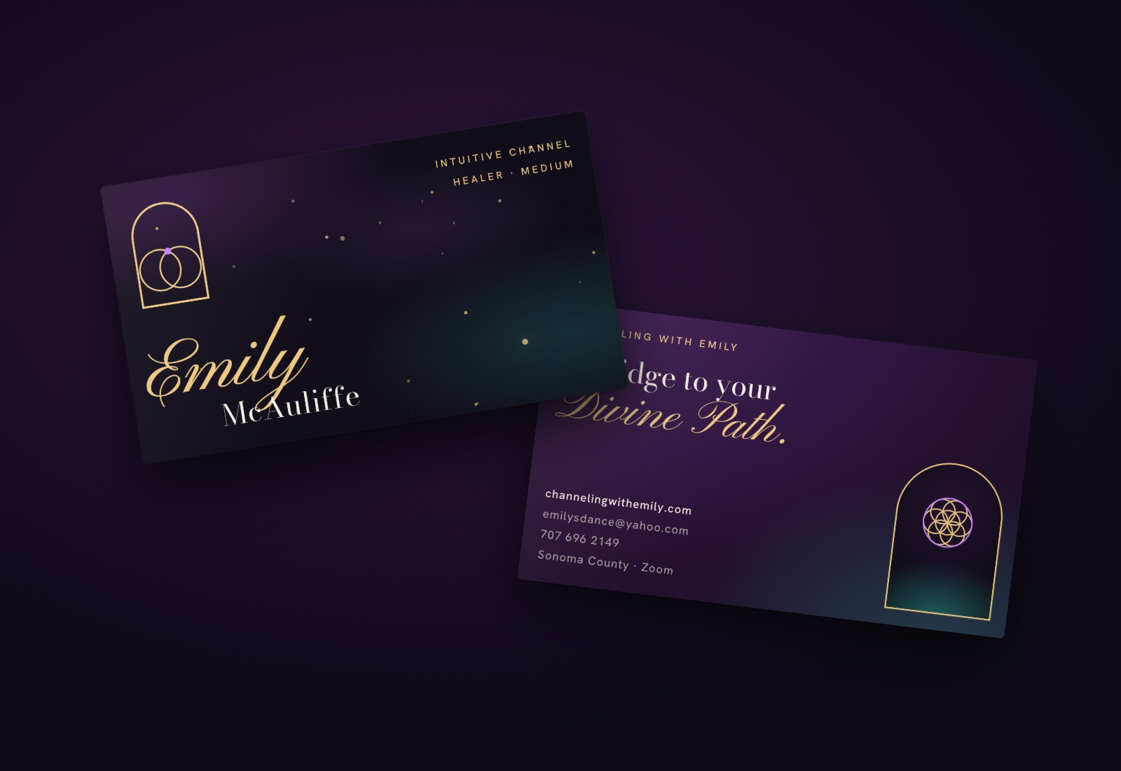 Emily's business cards, front and back, on a dark table