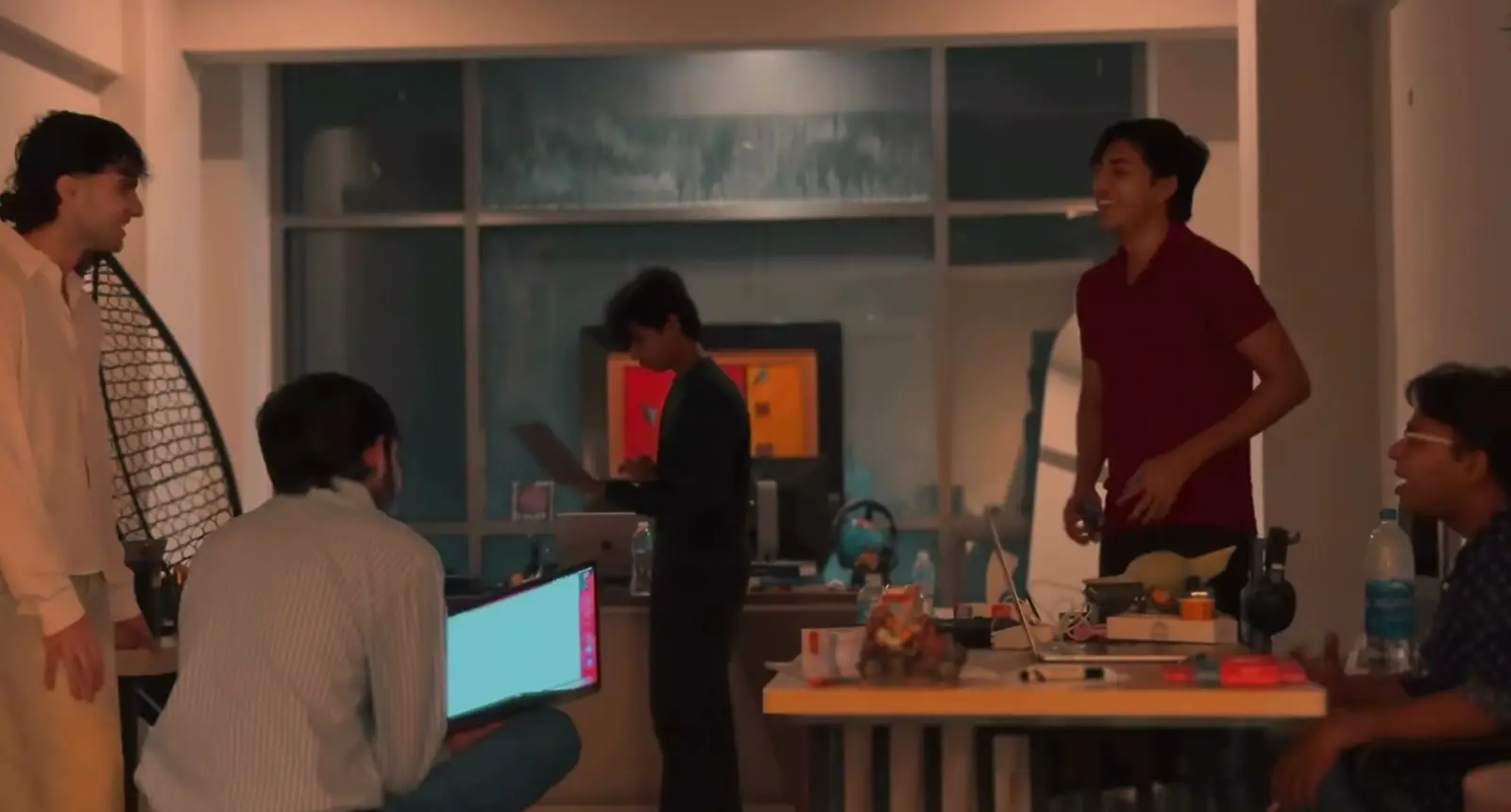 The team at their desks in the studio, from the brand film.